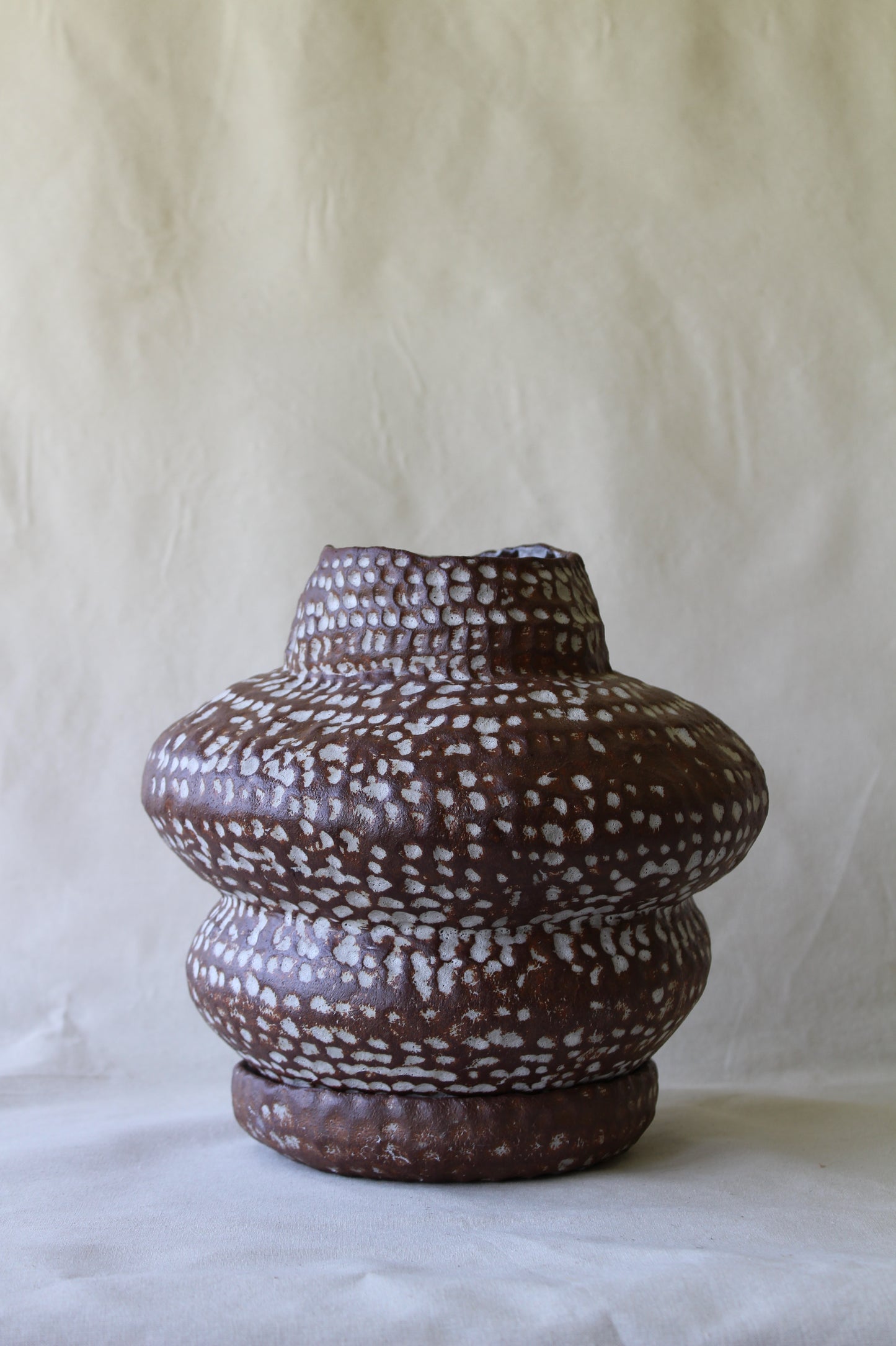 Brown sculptural stoneware planter