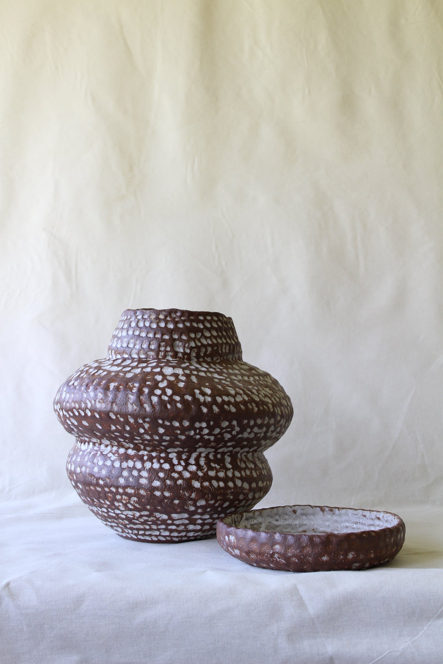 Brown sculptural stoneware planter